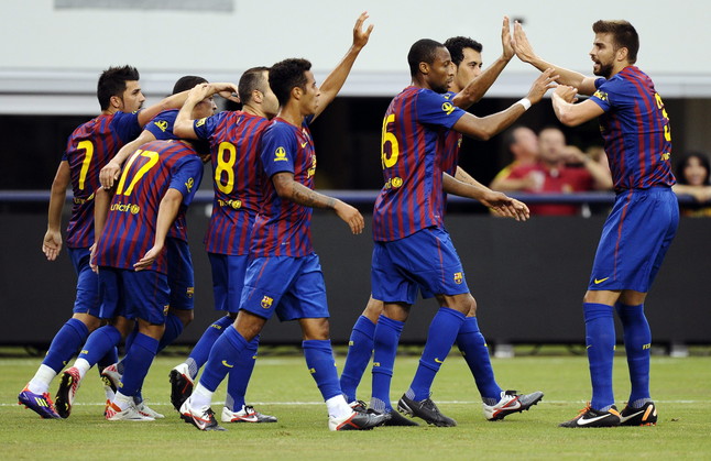 Los jugadores del Barça celebran el gol de Villa ante el América de México. LARRY W. SMITH | EFE