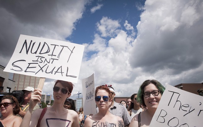 Hundreds of people demonstrate for the right of women to walk around topless